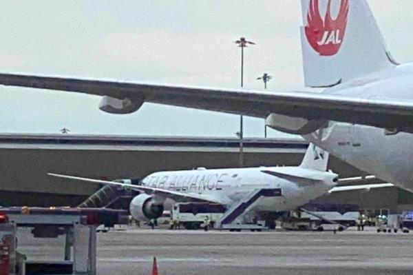 An ambulance waits to transport passengers from a London-Singapore flight that encountered severe turbulence, in Bangkok, Thailand, Tuesday, May 21, 2024. The plane apparently plummeted for a number of minutes before it was diverted to Bangkok, where emergency crews rushed to help injured passengers amid stormy weather, Singapore Airlines said Tuesday. (AP Photo/Sakchai Lalit)